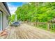 Spacious wooden deck with outdoor seating overlooking lush greenery at 5739 Paradise Dr, Martinsville, IN 46151