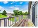 Open air wooden deck with railing showcasing distant home at 5739 Paradise Dr, Martinsville, IN 46151