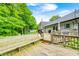 Multi-level wooden deck with seating offering views of the backyard at 5739 Paradise Dr, Martinsville, IN 46151