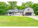 Charming home featuring a blend of architectural styles and an attached two car garage at 5739 Paradise Dr, Martinsville, IN 46151