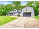 Charming home featuring a blend of architectural styles and an attached two car garage at 5739 Paradise Dr, Martinsville, IN 46151