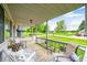 Spacious front porch with outdoor seating overlooking the lush front yard at 5739 Paradise Dr, Martinsville, IN 46151