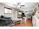 Bright living room featuring hardwood floors, a ceiling fan, and natural light from the windows at 5739 Paradise Dr, Martinsville, IN 46151