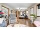 Open-concept living room featuring hardwood floors, comfortable seating, and a staircase leading to the upper level at 5739 Paradise Dr, Martinsville, IN 46151