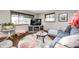 Bright living room featuring hardwood floors, a comfortable seating area, and natural light from the windows at 5739 Paradise Dr, Martinsville, IN 46151