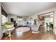 Comfortable living room with hardwood floors, a cozy seating area, and access to the kitchen at 5739 Paradise Dr, Martinsville, IN 46151