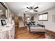 Spacious living room with hardwood floors, comfortable seating, and a staircase leading to the upper level at 5739 Paradise Dr, Martinsville, IN 46151