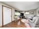 Bright living room featuring hardwood floors, a comfortable seating area, and natural light from the windows at 5739 Paradise Dr, Martinsville, IN 46151