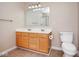 Bathroom featuring double sink vanity, standard toilet, and modern lighting at 6105 Franklin Villas Way, Indianapolis, IN 46237