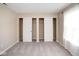 Bedroom featuring carpeted floors and sliding door closets at 6105 Franklin Villas Way, Indianapolis, IN 46237
