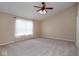 Bedroom featuring carpet, a ceiling fan, and a large window at 6105 Franklin Villas Way, Indianapolis, IN 46237