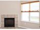 Living room view of fireplace, window with blinds and view of outside at 6105 Franklin Villas Way, Indianapolis, IN 46237
