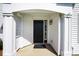 Inviting front porch features a stylish black door, white siding, and elegant lantern fixture at 6105 Franklin Villas Way, Indianapolis, IN 46237