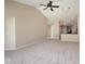 Living room with high ceilings, ceiling fan, and view into the kitchen area at 6105 Franklin Villas Way, Indianapolis, IN 46237