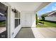 Outdoor patio with a light fixture and a white door at 6105 Franklin Villas Way, Indianapolis, IN 46237