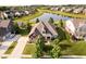 Beautiful home boasts manicured lawn, mature trees, and a serene pond view at 6337 Ederline Ln, Noblesville, IN 46062