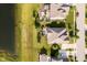 Aerial view of backyard and adjacent pond with manicured lawn and landscaping at 6337 Ederline Ln, Noblesville, IN 46062