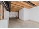 Unfinished basement with visible ductwork, plastic-covered walls, and an open door at 6337 Ederline Ln, Noblesville, IN 46062