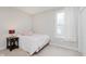 Cozy bedroom with a window that lets in natural light and a bedside table at 6337 Ederline Ln, Noblesville, IN 46062