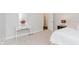 Bright bedroom with a white vanity, mirror, and view of the doorway at 6337 Ederline Ln, Noblesville, IN 46062