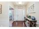 Bright foyer with stylish décor and hardwood flooring welcomes guests at 6337 Ederline Ln, Noblesville, IN 46062