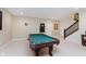 Spacious game room with a pool table, carpet flooring, and a staircase at 6337 Ederline Ln, Noblesville, IN 46062