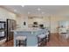 Modern kitchen with stainless steel appliances, granite countertops, and a breakfast bar with seating at 6337 Ederline Ln, Noblesville, IN 46062