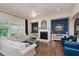 Comfortable living room with fireplace, stylish accents, and backyard view at 6337 Ederline Ln, Noblesville, IN 46062