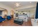 Bright living room featuring hardwood floors, elegant furnishings, and an open layout to the kitchen at 6337 Ederline Ln, Noblesville, IN 46062