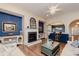 Spacious living room with fireplace, wood floors, and open concept design at 6337 Ederline Ln, Noblesville, IN 46062
