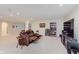 Comfortable living room with plush reclining seating, a bookshelf, and a large television at 6337 Ederline Ln, Noblesville, IN 46062