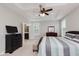 Spacious primary bedroom with ceiling fan, large windows and an ensuite bathroom at 6337 Ederline Ln, Noblesville, IN 46062