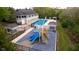 Aerial view of the neighborhood pool and playground, featuring a pool, playground, and covered picnic areas at 6337 Ederline Ln, Noblesville, IN 46062