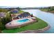 Aerial view of a community pool and lounge area with lakefront views at 6337 Ederline Ln, Noblesville, IN 46062