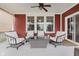 Relaxing covered porch features comfortable seating, ceiling fan, and views of the surrounding landscape at 6337 Ederline Ln, Noblesville, IN 46062