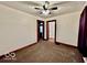 Bedroom features neutral walls, carpeted floor, ceiling fan, and wood trim at 640 S Sycamore St, Martinsville, IN 46151