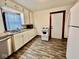 Efficient kitchen with new vinyl floors, plenty of cabinets, and new appliances at 640 S Sycamore St, Martinsville, IN 46151