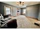 Comfortable living room with ceiling fan, neutral paint, and good natural light at 640 S Sycamore St, Martinsville, IN 46151