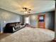 Clean living room with carpet, neutral paint, and good natural light at 640 S Sycamore St, Martinsville, IN 46151