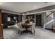 Finished basement with wet bar, open entertaining space, and stylish sliding barn doors at 6450 Holliday E Dr, Indianapolis, IN 46260