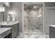 Stylish bathroom featuring glass shower, elegant vanity, and marble accents at 6450 Holliday E Dr, Indianapolis, IN 46260