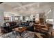 Spacious living room featuring an open-concept design with hardwood floors and ample seating at 6450 Holliday E Dr, Indianapolis, IN 46260