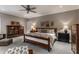 Bright main bedroom with wooden furniture, large bed, and a decorative bookcase at 6450 Holliday E Dr, Indianapolis, IN 46260