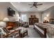 Spacious main bedroom featuring neutral walls, ceiling fan and comfortable seating area at 6450 Holliday E Dr, Indianapolis, IN 46260