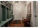 Inviting mudroom with custom lockers, built-in bench, and convenient storage solutions at 6450 Holliday E Dr, Indianapolis, IN 46260