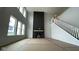 Spacious living room featuring a modern fireplace with a dark accent wall and plenty of room for entertaining at 6462 Stone Side Dr, Plainfield, IN 46168