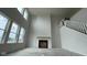 Bright living room with a fireplace and large windows, enhancing the feeling of spaciousness and grandeur at 6462 Stone Side Dr, Plainfield, IN 46168