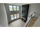 Open living room with a fireplace, large windows, and plenty of natural light showcases a cozy and modern space at 6462 Stone Side Dr, Plainfield, IN 46168