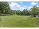 Large, fenced backyard with ample green space and a patio area, perfect for outdoor entertaining at 65 Millet Ct, Danville, IN 46122