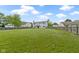 Expansive, fully fenced backyard featuring lush green grass and privacy at 65 Millet Ct, Danville, IN 46122
